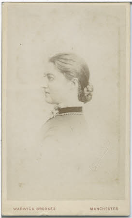Monochrome bust of young woman in profile.