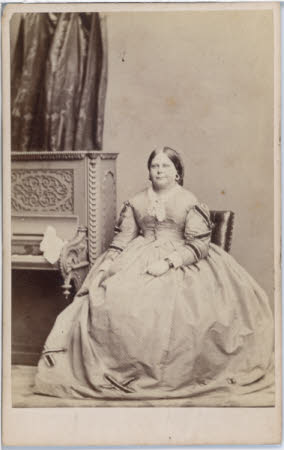 A full length portrait of a unknown seated lady