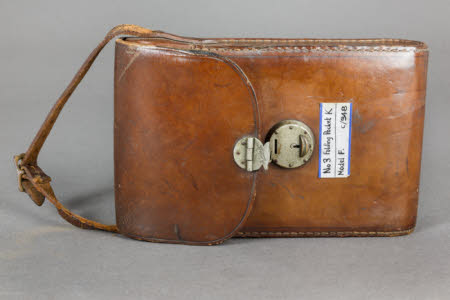 Brown leather case with strap