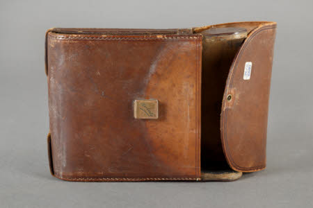 Brown leather Kodak camera case.