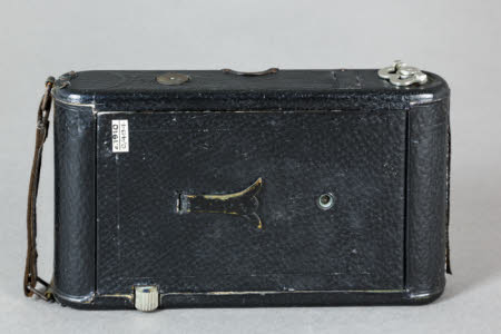 A Carbine folding roll film camera by Butcher and Sons Ltd.