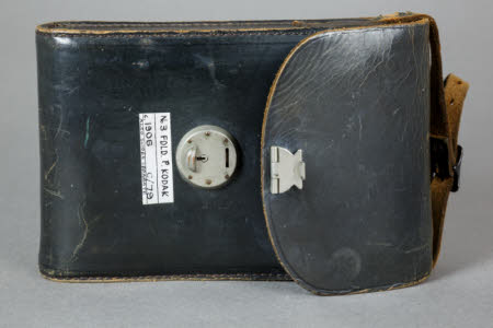 Leather camera case with metal clasp.