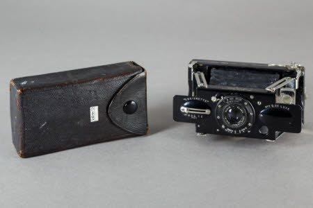 No.2D Ensignette de luxe small rollfilm camera with black leather case.
