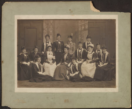 Group of women, two in Red Cross uniforms. 