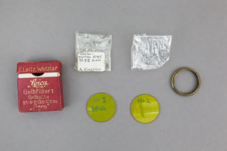 Two yellow filters with a mounting ring for Leica camera
