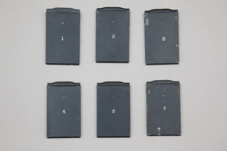 Set of six photographic plate holders.