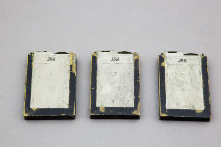 A set of three double photographic plate holders.