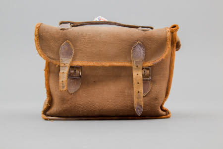 Brown canvas case for folding field camera.