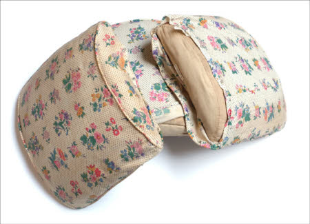 Three chair seat pads and covers.
