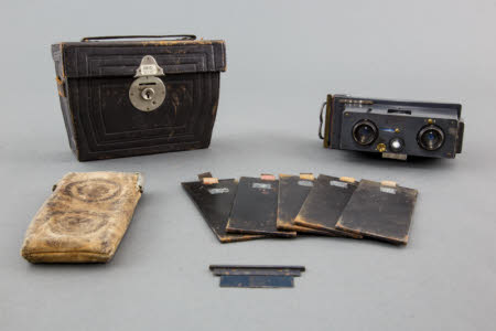 A Richard Verascope stereo camera with leather case, and a separate leather wallet with five ...
