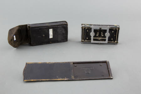 A Baudry Isographe stereo folding camera with soft leather case.