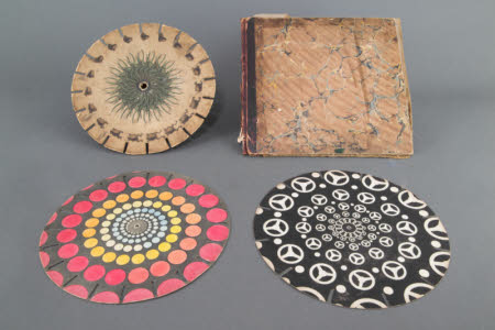Card folder containing 3 Phenakistoscope discs.