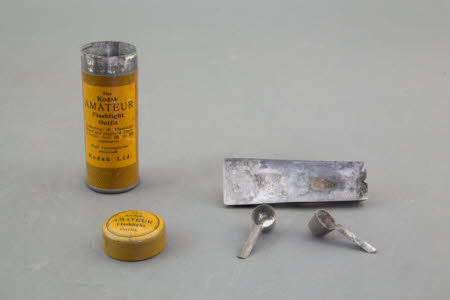 A Kodak Amateur Flashlight Outfit in original tin case