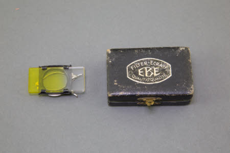 A RHACO sliding yellow graduated filter in a  box