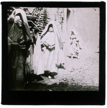 Three women in middle-eastern dress.