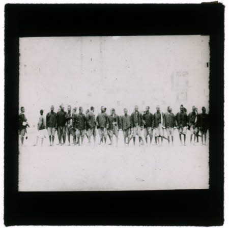 A row of African men in uniform.