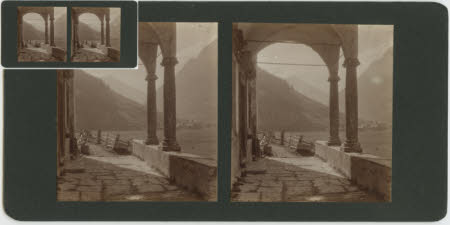 A mountain view, taken from an arched terrace