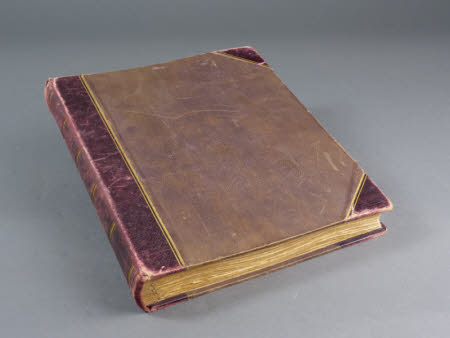 Photographic album bound in brown leather with leather spine, containing 73 mounted photographs of ...