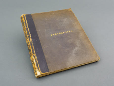 A 19th Century album containing 77 albumen print photographs.  A dark grey cloth board photograph ...
