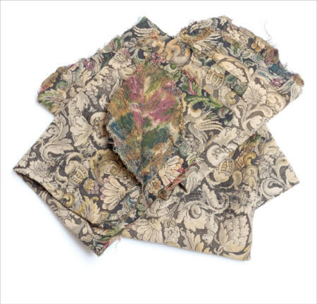 Five former chair seat covers.