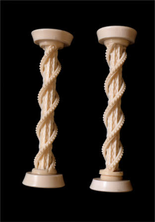 A pair of ornately turned ivory columns.