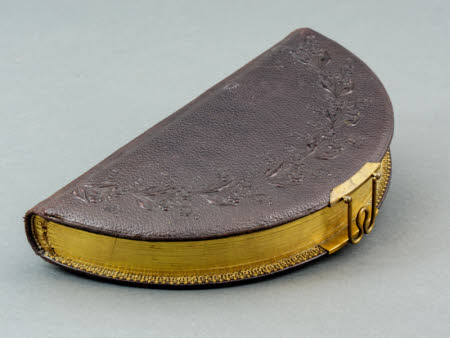 A 19th Century sem-circular embossed brown leather carte-de-visite album.