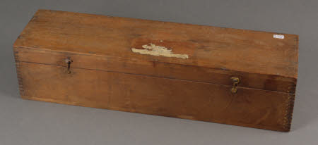 A wooden box containing 4 sets of hand coloured glass lantern slides.