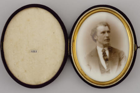 A portrait of a man in a case.