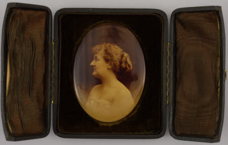 A portait of a woman, in a case.