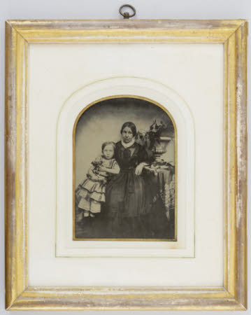Portrait of a woman and young girl.