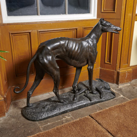 A greyhound with a hare