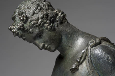 A bronze figure of Narcissus and the Venus Calipigia by Anonymous