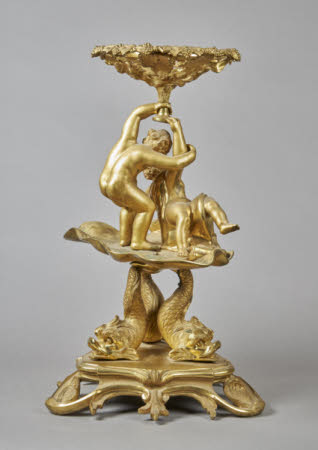 A Louis Phillippe style centrepiece of a tazza formed of a fruiting vine supported by two playful ...