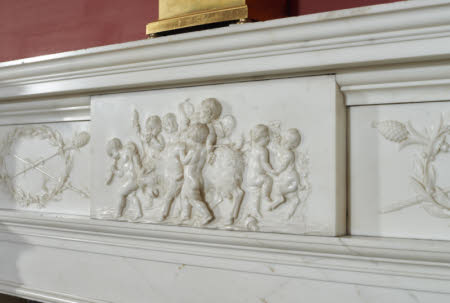 Chimneypiece, with twin Doric columns and a frieze with dancing putti, drinking and making music, ...