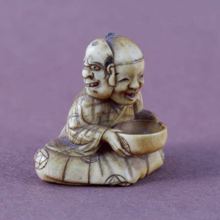 Netsuke of a seated actor